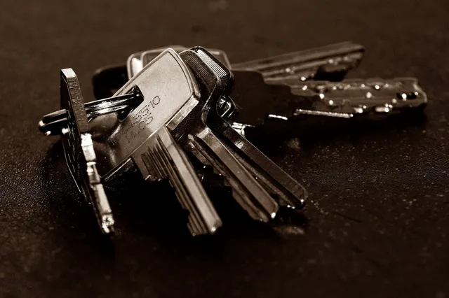 A locksmith working on a door lock in Montgomery, AL