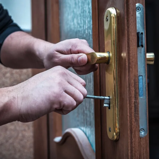Testing a new key in a front door lock after a rekeying service in Montgomery, AL